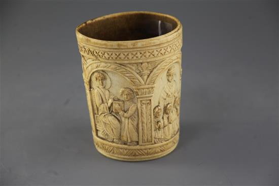 A carved ivory situla, late 19th century in Medieval style, height 6.5in.